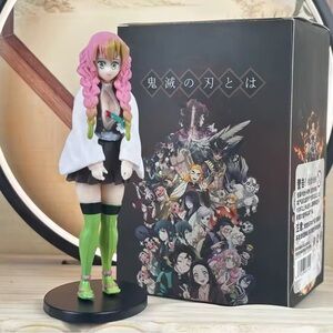 Anime Figure with Green and Pink Details